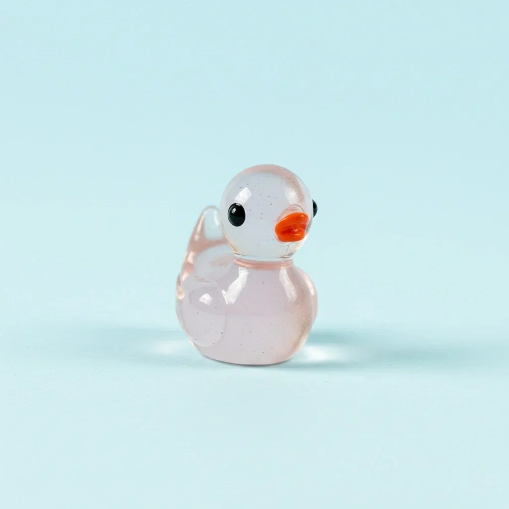 Miniature Glow Duck Assorted (1pc) displayed on a light blue background