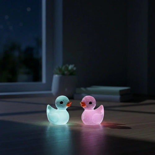 Miniature Glow Duck Assorted (1pc) glowing in a dark setting